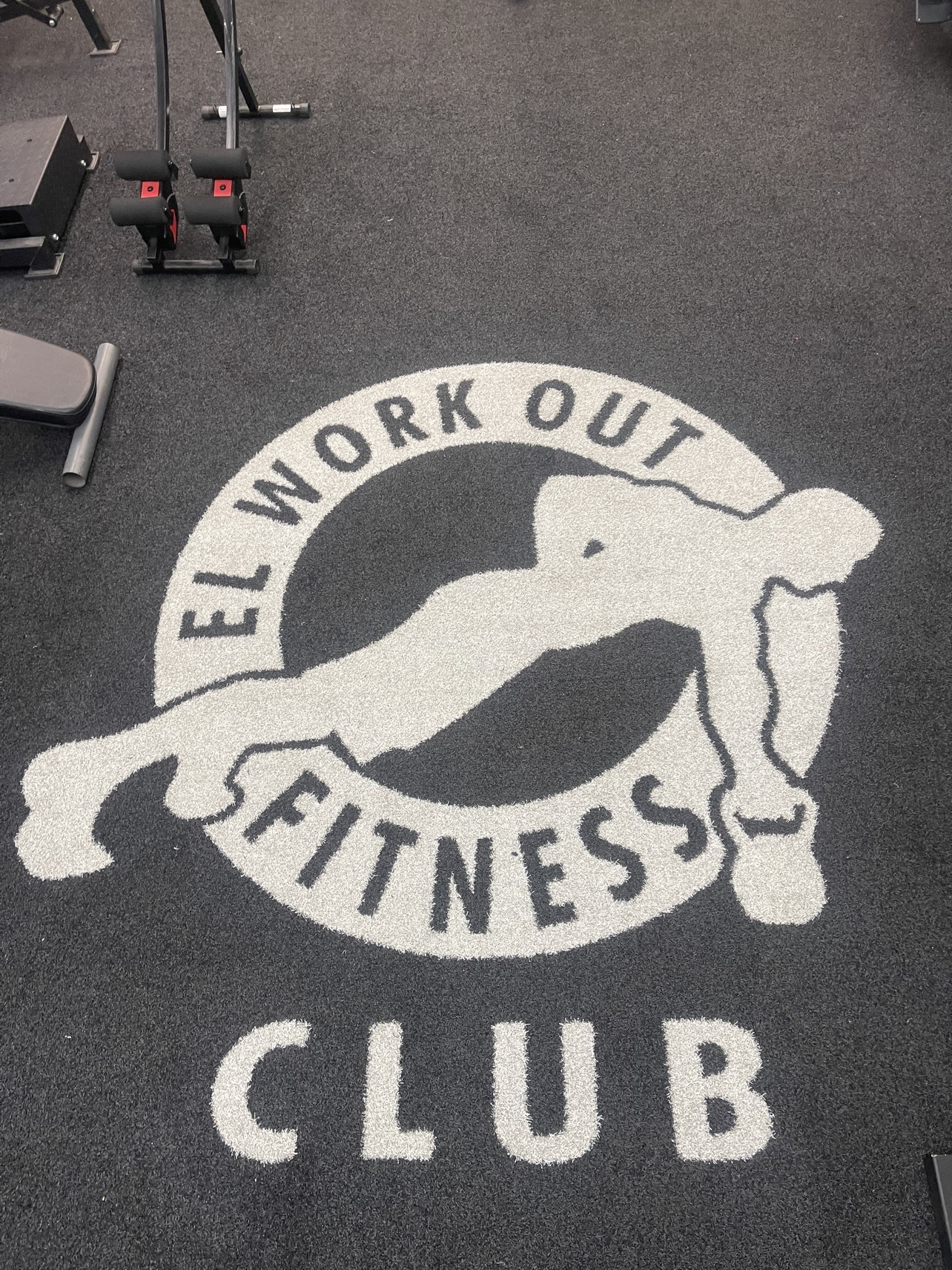 The El Workout Fitness Club logo painted on the studio floor